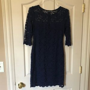 Woman’s royal blue lace cocktail dress